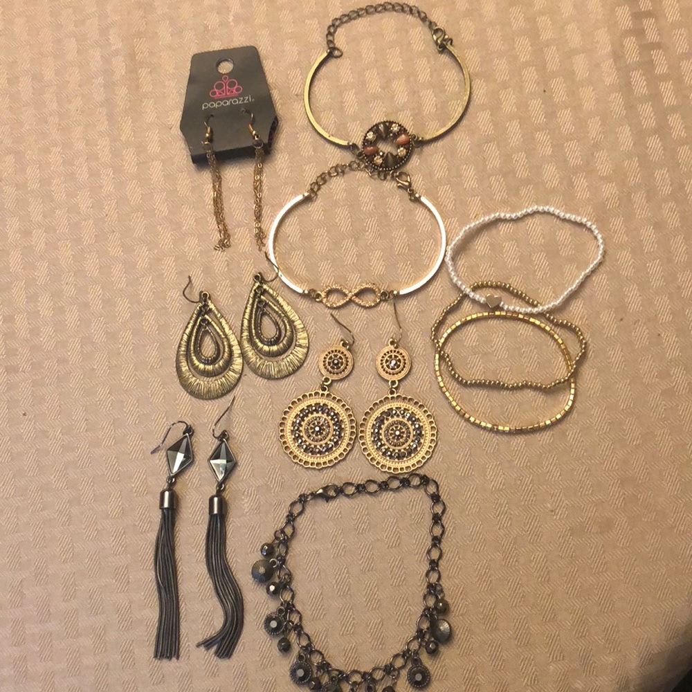 Set of various gold and gunmetal jewelry